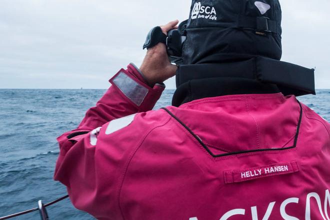 Onboard Team SCA - Stacey Jackson with the binoculars pointing at Dongfeng at the horizon - Leg five to Itajai - Volvo Ocean Race 2015 © Anna-Lena Elled/Team SCA